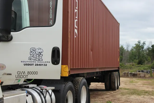 Side profile of Southern Haulers cab with SH branding on the door, 2024